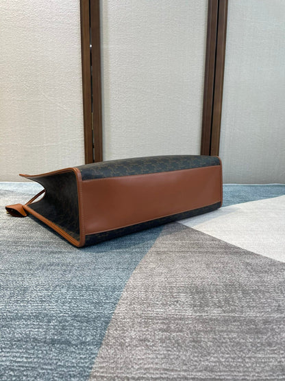 CELINE 25S HORIZONTAL CABAS 43MM IN BLACK TRIOMPHE CANVAS AND TAN BROWN CALFSKIN