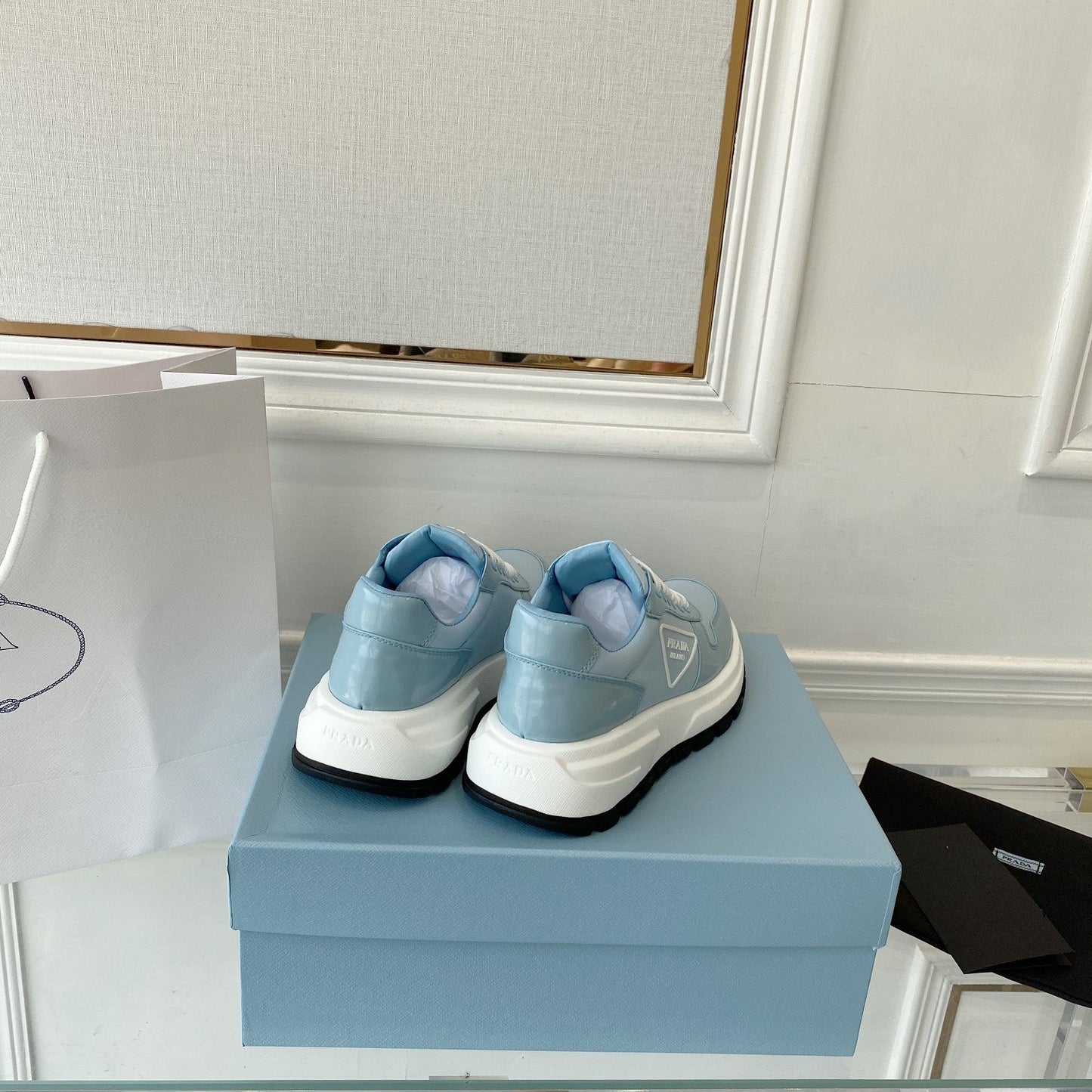 PRADA 25S THICK SOLE SNEAKER IN LIGHT BLUE CALFSKIN AND CANVAS