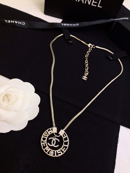 CHANEL 26S CHANEL CC LOGO MADEMOISELLE ROUND NECKLACE IN GOLD METAL 633322