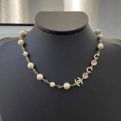 CHANEL 26S DOUBLE C LETTER PEARL NECKLACE WITH HEART CHARMS IN GOLD METAL 631850