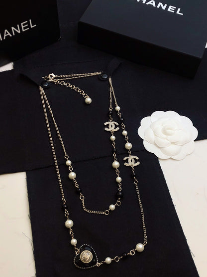 CHANEL 26S DOUBLE C LOGO BLACK & WHITE PEARL BEADED LONG NECKLACE WITH HEART CHARM IN SILVER METAL 631832