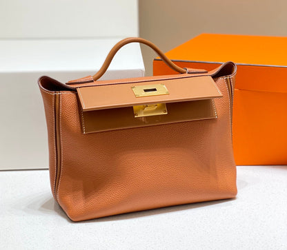 HM 26S 24/24 29MM IN ORANGE EVERCOLOR CALFSKIN GOLD KELLY BUCKLE