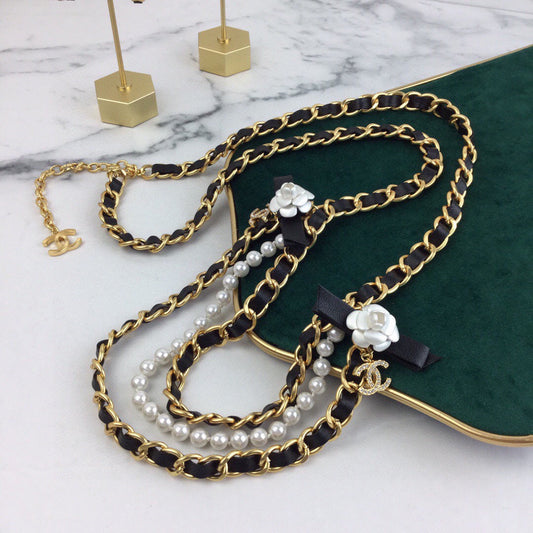 CHANEL 25S CHAIN BELT IN WHITE PEARL AND BLACK CALFSKIN 614403