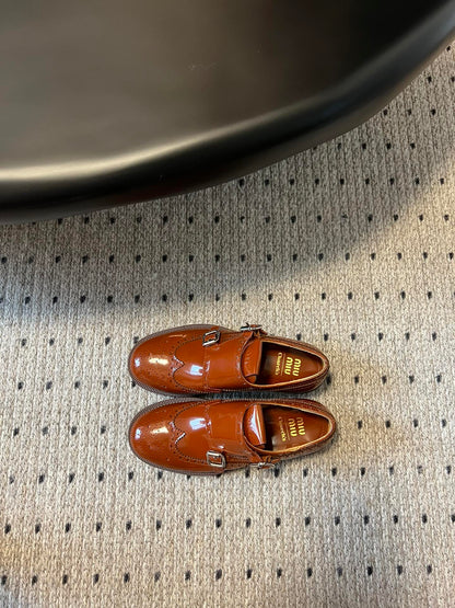MIUMIU 26S CHURCH BROGUE MONK STRAP SHOES IN RUST ORANGE PATENT CALFSKIN
