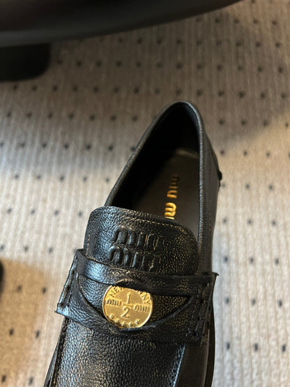 MIUMIU 26S PENNY LOAFERS IN BLACK CALFSKIN GOLD HARDWARE