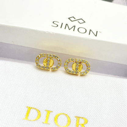 CD 26S CRYSTAL LOGO STUD EARRINGS IN GOLD METAL 633106