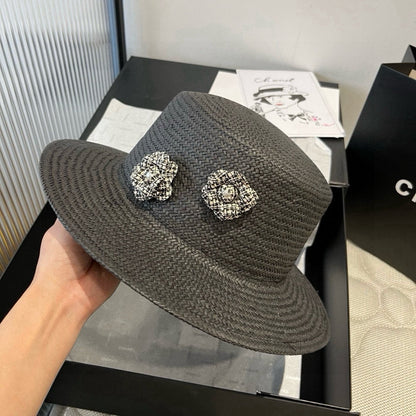 FLAT STRAW HAT BLACK FLOWER ATTACHMENT 673929