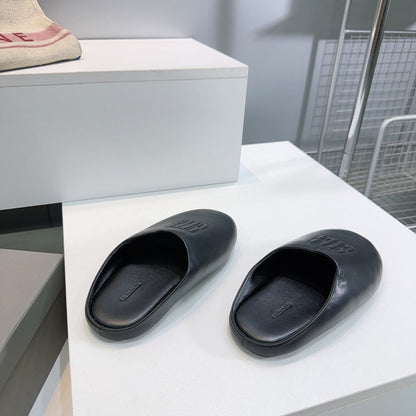 BALENCIAGA 25S MULES IN BLACK LAMBSKIN
