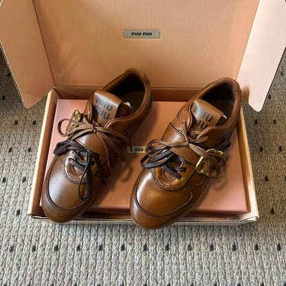 MIUMIU 26S GYMNASIUM SNEAKER IN COGNAC BROWN CALFSKIN WITH GOLD BUCKLED STRAP