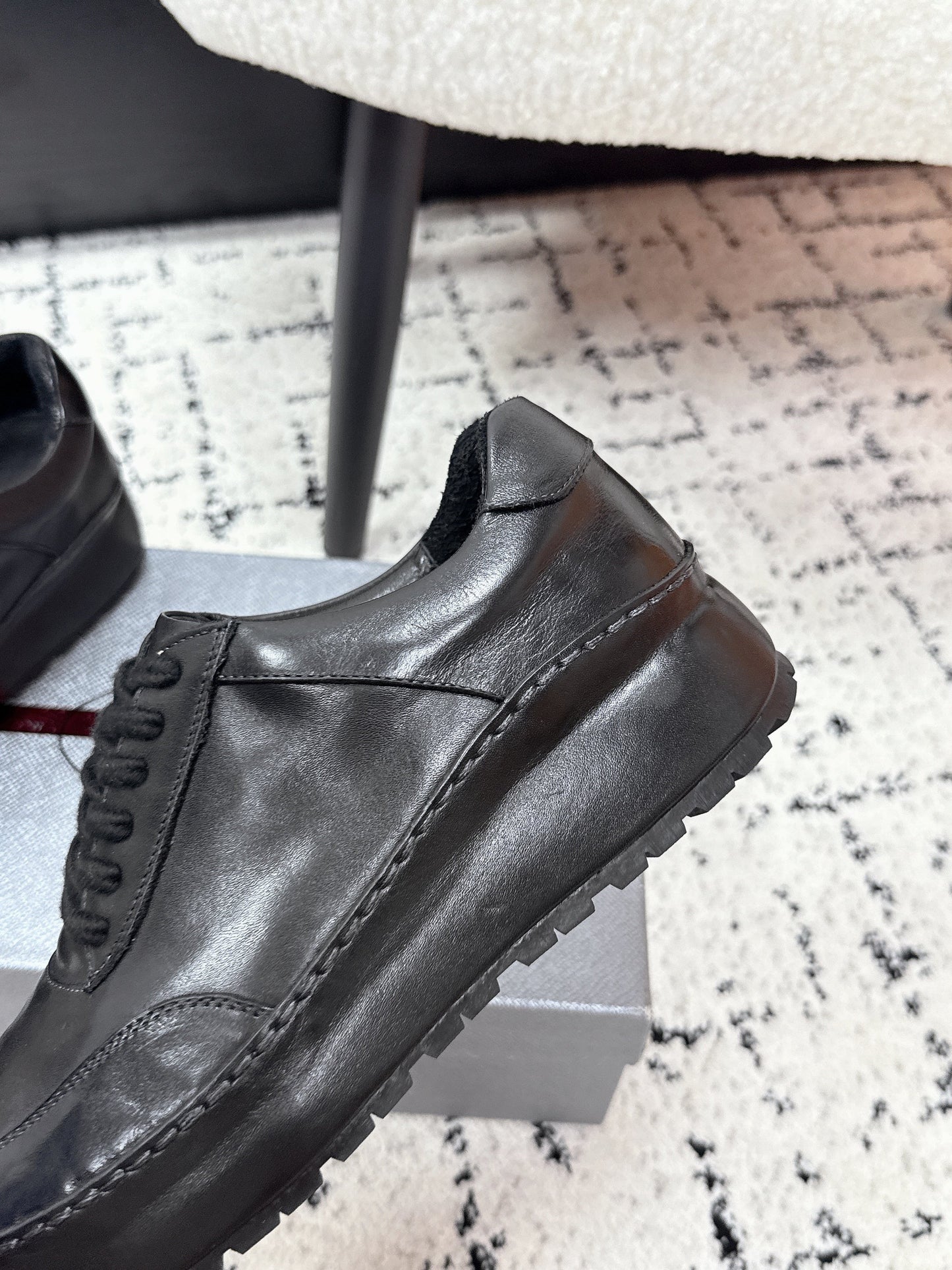 PRADA 26S SNEAKERS IN BLACK SHINY CALFSKIN