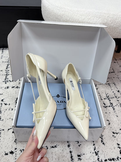 PRADA 26S POINTED-TOE HIGH HEELS 75MM IN IVORY WHITE PATENT CALFSKIN WITH BOW