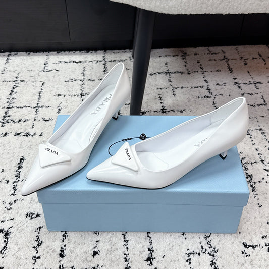 PRADA 26S POINTED-TOE HIGH HEELS 60MM IN WHITE PATENT CALFSKIN WITH LOGO