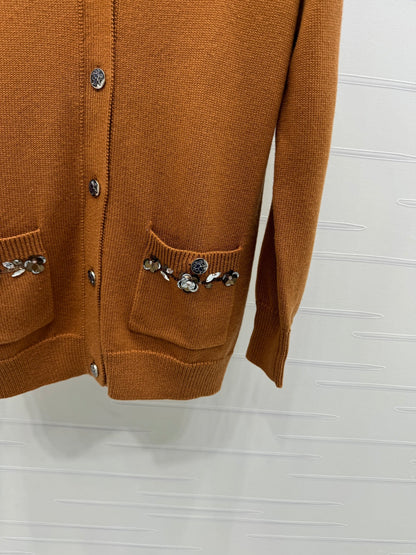 CHANEL HEAVY KNIT CARDIGAN WITH EMBELLISHED FLORAL DETAILS 274877