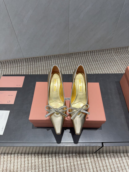 MIUMIU 26S POINTED TOE PUMPS 55MM IN GOLD CALFSKIN WITH BOW