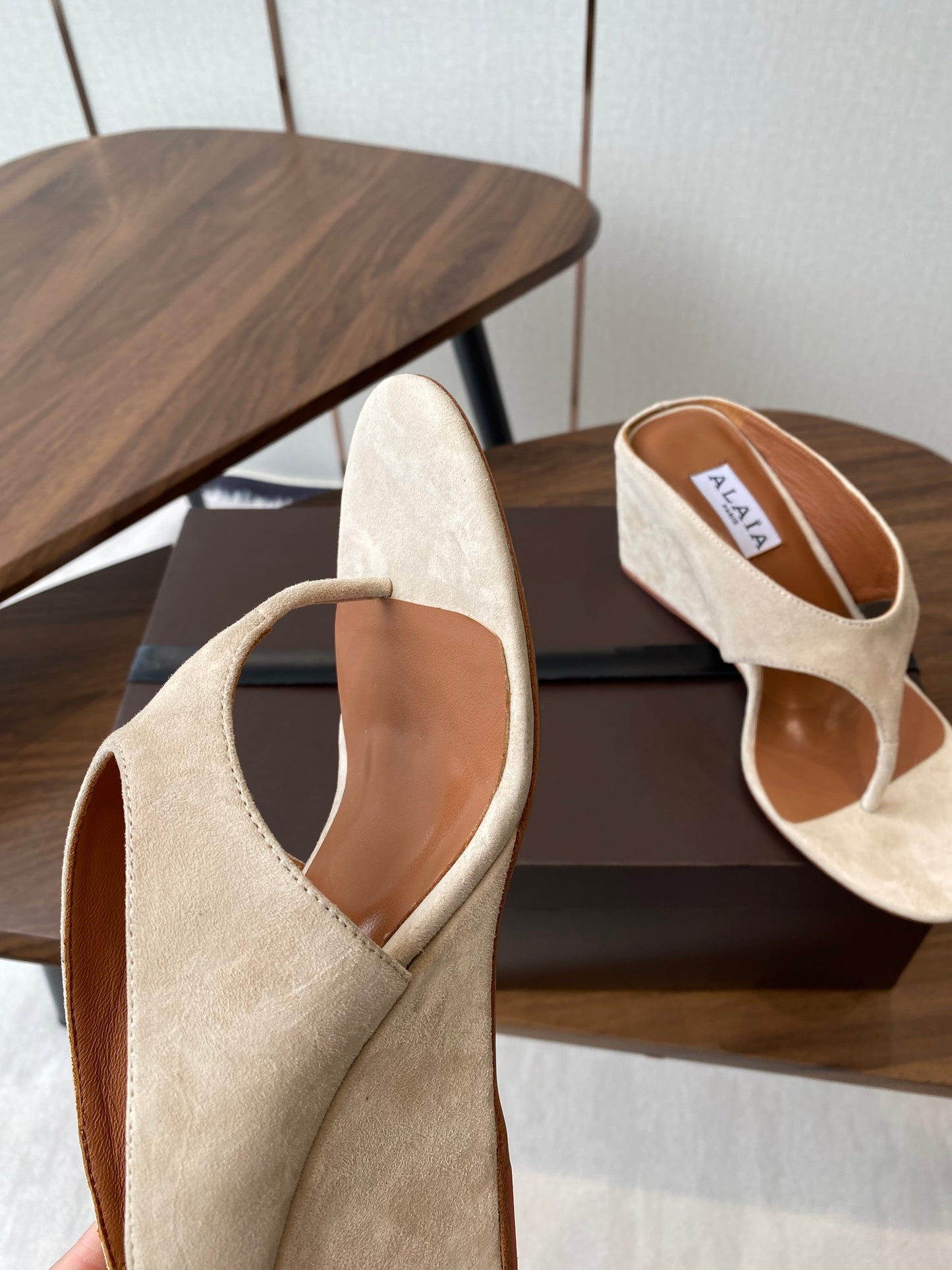 ALAIA WEDGE THONG SANDALS 25S IN LIGHT BEIGE SUEDE