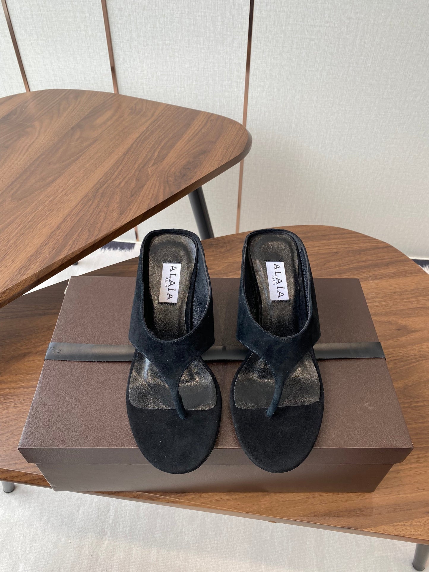 ALAIA WEDGE THONG SANDALS 25S IN BLACK SUEDE