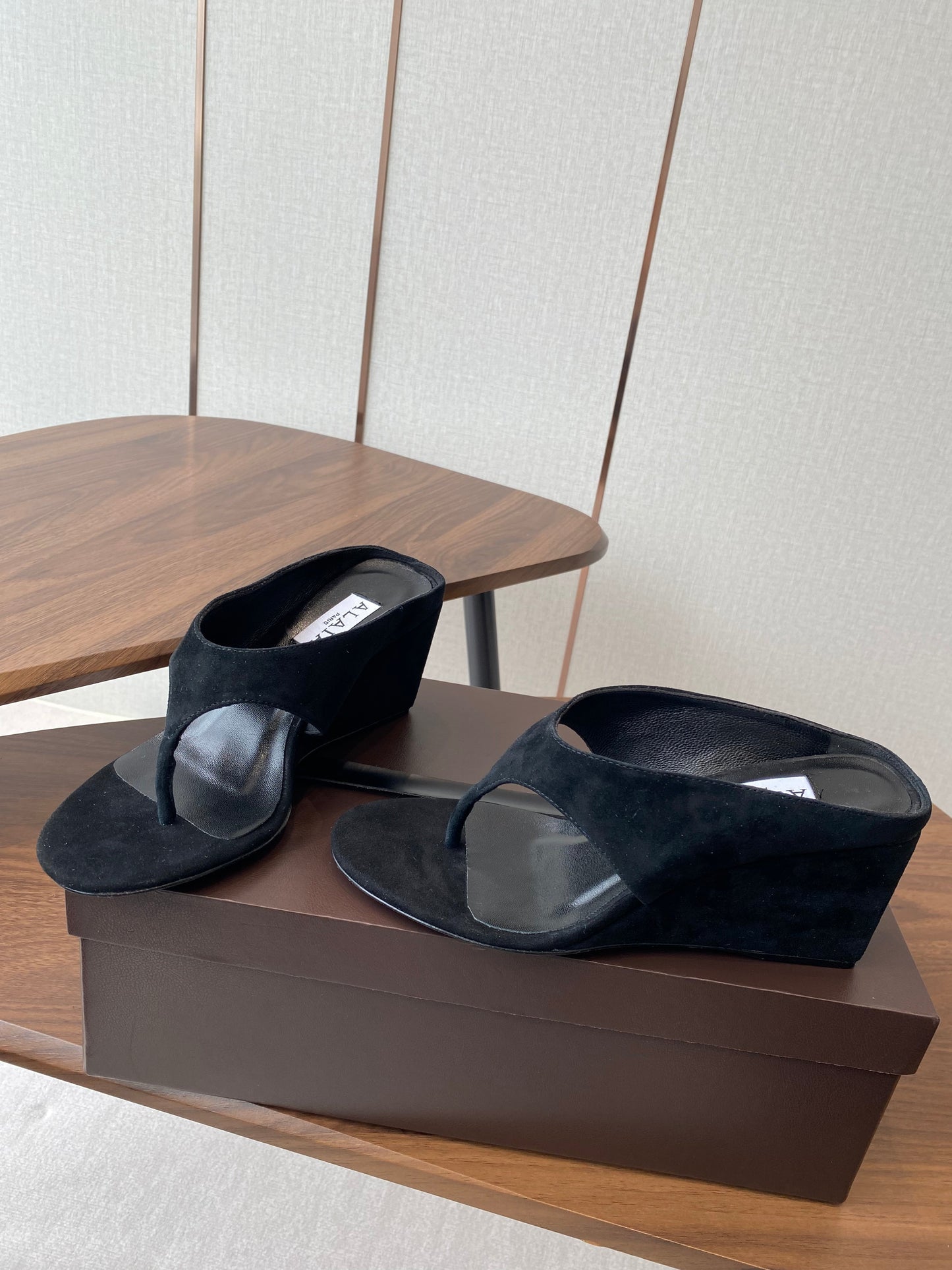 ALAIA WEDGE THONG SANDALS 25S IN BLACK SUEDE