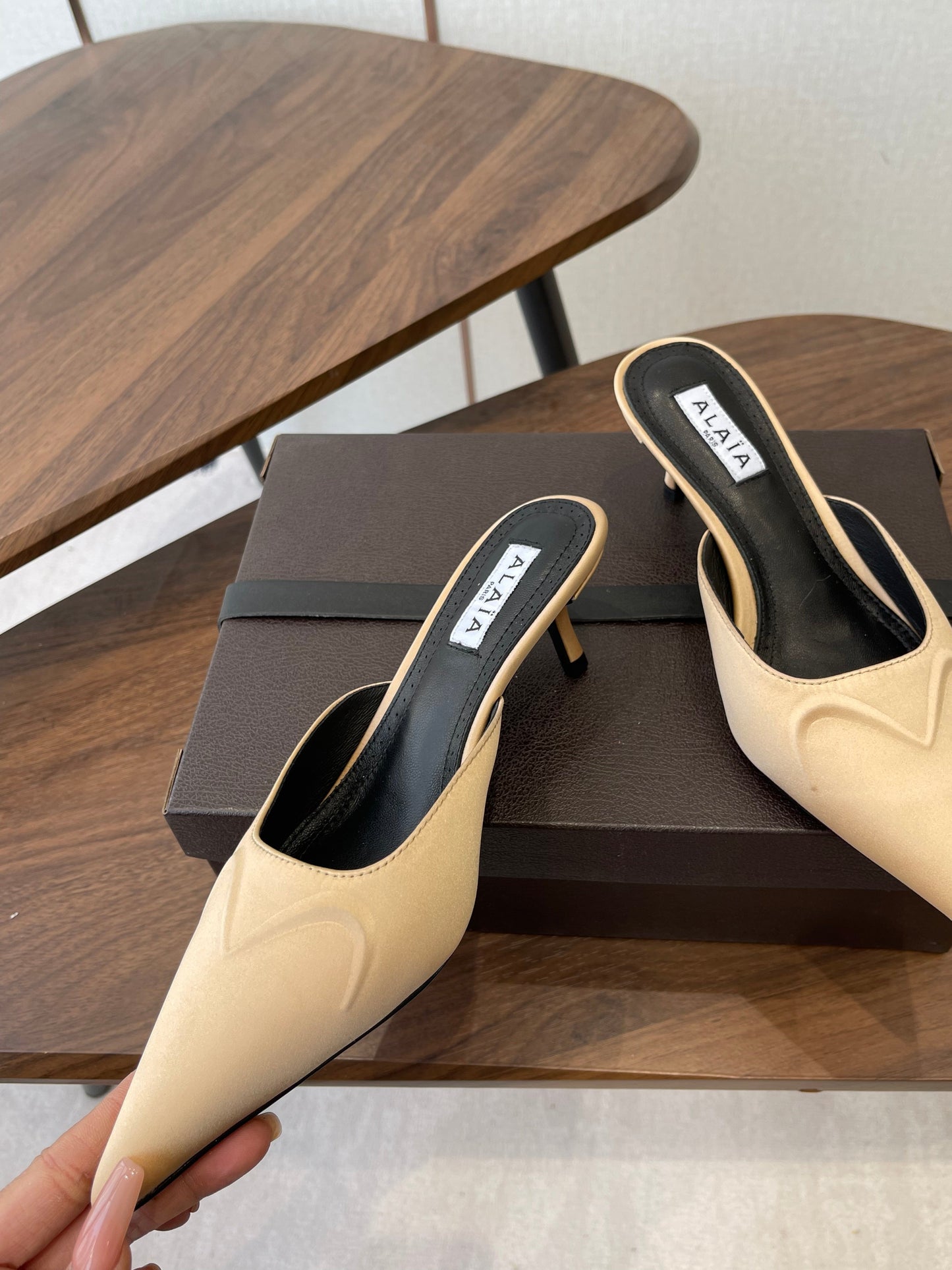 ALAIA 26S HEELED MULES 50 MM IN WARM BEIGE FABRIC