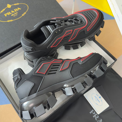 PRADA 26S CLOUDBUST THUNDER SNEAKERS 60MM IN BLACK AND RED MESH FABRIC AND TPU