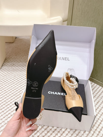 CHANEL 25S ESPADRILLE FLATS IN BEIGE AND BLACK CALFSKIN WITH PEARL STRAP