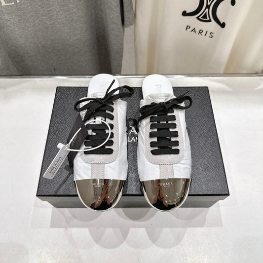 PRADA 25S MULES IN WHITE WITH METAL TOECAP