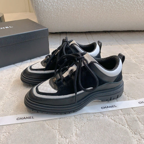 CHANEL 25S TRAINERS 40MM IN BLACK AND WHITE CALFSKIN AND SUEDE