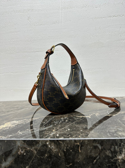 CELINE 25S TEEN LULU BAG 24 IN BLACK TRIOMPHE CANVAS AND BROWN CALFSKIN TRIM