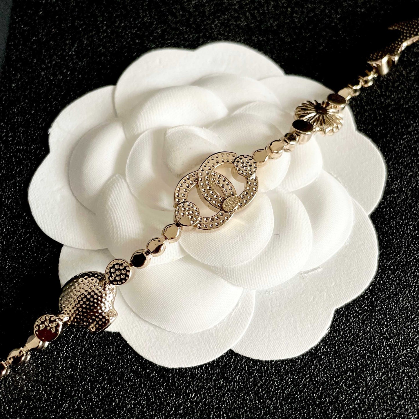 CHANEL 26S DOUBLE C LOGO CRYSTAL MULTI-CHARM STATEMENT BRACELET IN GOLD METAL 629170