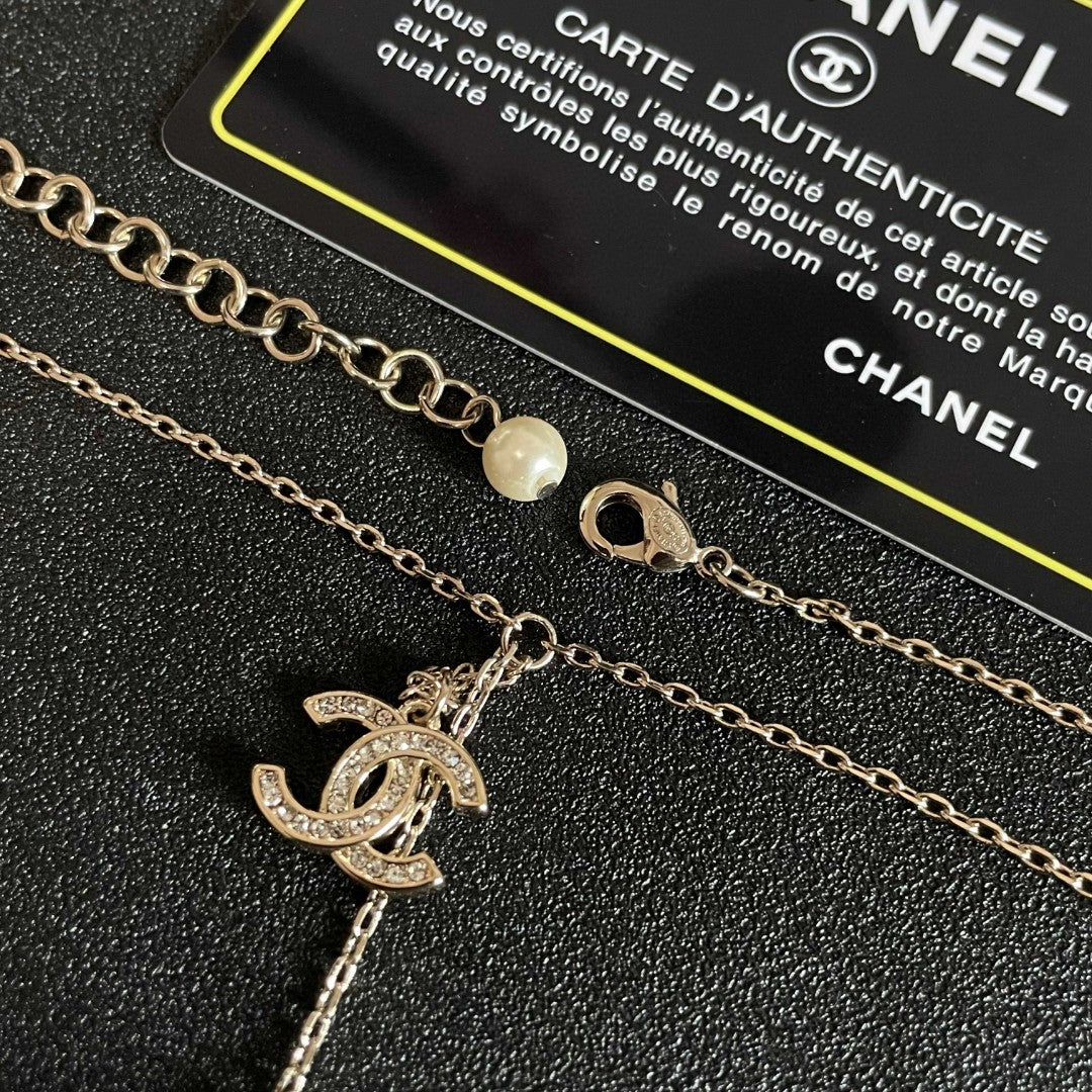 CHANEL 26S DOUBLE C LOGO PEARL FLOWER DROP NECKLACE IN GOLD METAL 629173