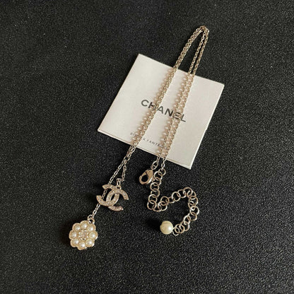 CHANEL 26S DOUBLE C LOGO PEARL FLOWER DROP NECKLACE IN GOLD METAL 629173