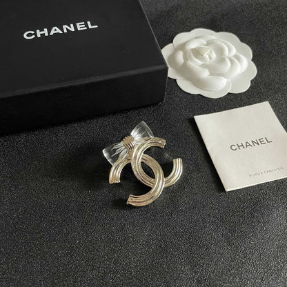 CHANEL 26S DOUBLE C LOGO BOW DETAIL OPENWORK BROOCH IN GOLD METAL 629193