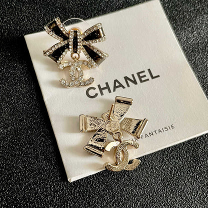 CHANEL 26S DOUBLE C LOGO CRYSTAL BOW DROP EARRINGS IN GOLD METAL 629981