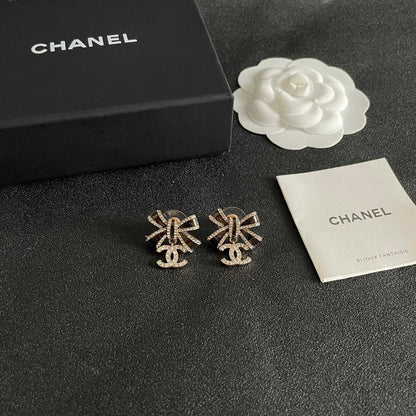 CHANEL 26S DOUBLE C LOGO CRYSTAL BOW DROP EARRINGS IN GOLD METAL 629981