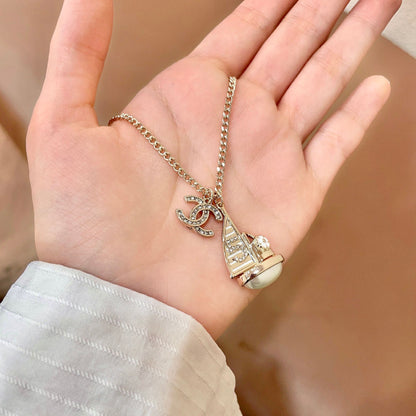 CHANEL 26S DOUBLE C LOGO SAILBOAT PENDANT NECKLACE WITH PEARL IN GOLD METAL 630060