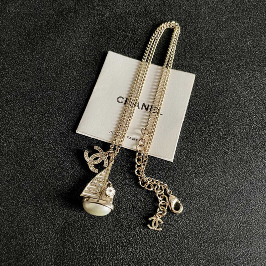 CHANEL 26S DOUBLE C LOGO SAILBOAT PENDANT NECKLACE WITH PEARL IN GOLD METAL 630060