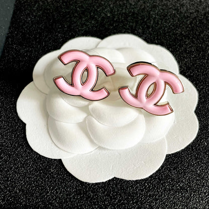 CHANEL 26S DOUBLE C LOGO PINK ENAMEL STUD EARRINGS IN GOLD METAL 630066