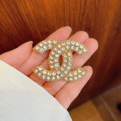 CHANEL 26S DOUBLE C LOGO FULL PAVE CRYSTAL BROOCH IN GOLD METAL 630079