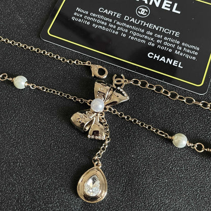 CHANEL 26S DOUBLE C LOGO PEARL LAYERED CHAIN BOW & CRYSTAL DROP NECKLACE IN GOLD METAL 629883
