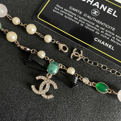 CHANEL 26S DOUBLE C LOGO MULTICOLOR GEMSTONE PEARL CHAIN BRACELET WITH CRYSTAL PENDANT IN GOLD METAL 629888