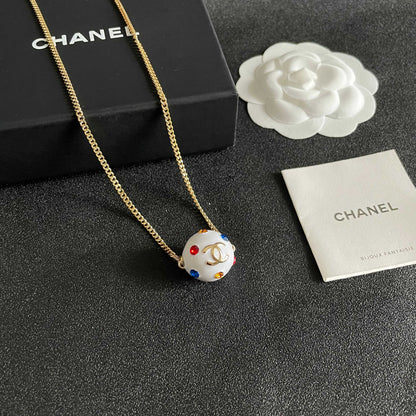 CHANEL 26S DOUBLE C LOGO WHITE ENAMEL CRYSTAL BALL PENDANT NECKLACE IN GOLD METAL 629889