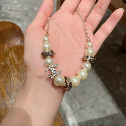 CHANEL 26S DOUBLE C LOGO PEARL BEADED BRACELET WITH CRYSTAL DETAIL IN GOLD METAL 631014