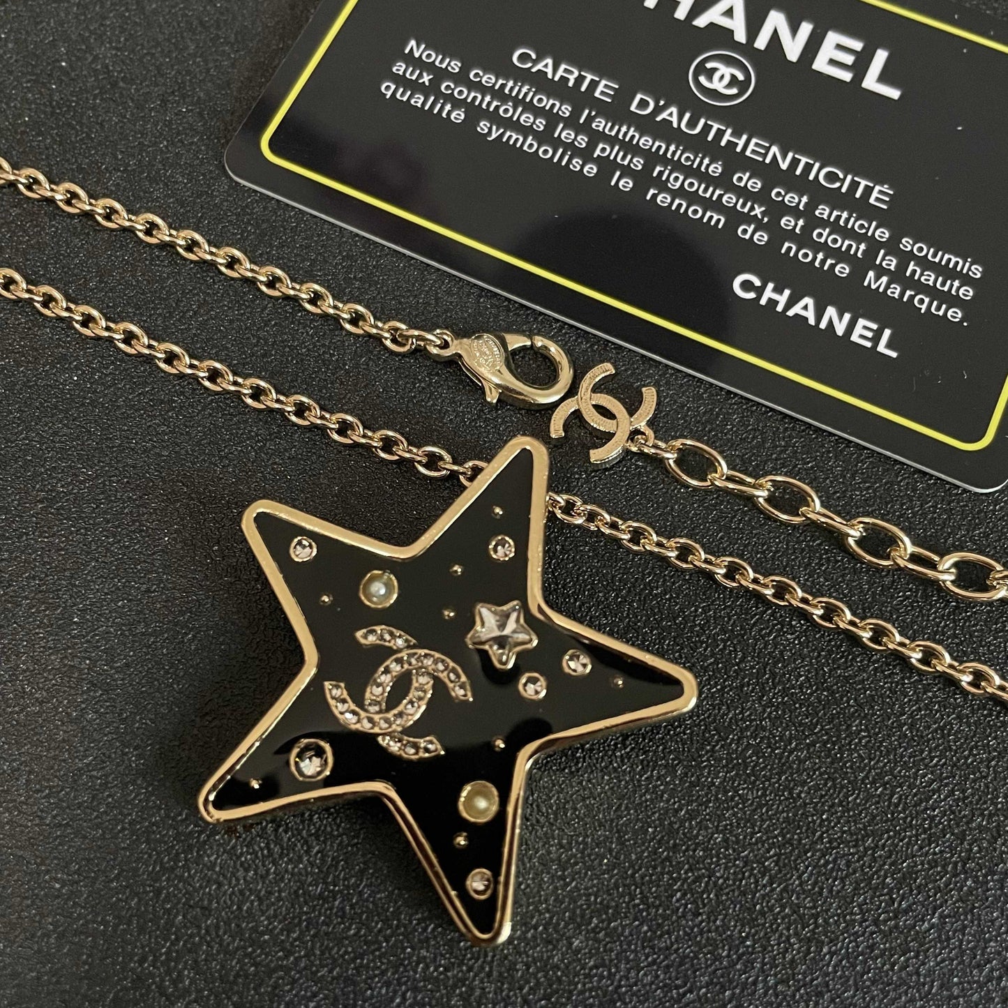 CHANEL 26S DOUBLE C LOGO BLACK ENAMEL STAR PENDANT NECKLACE WITH CRYSTAL DETAIL IN GOLD METAL 631015