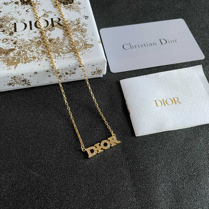 CD 26S PAVE LOGO LETTER NECKLACE IN GOLD TONE METAL 631806