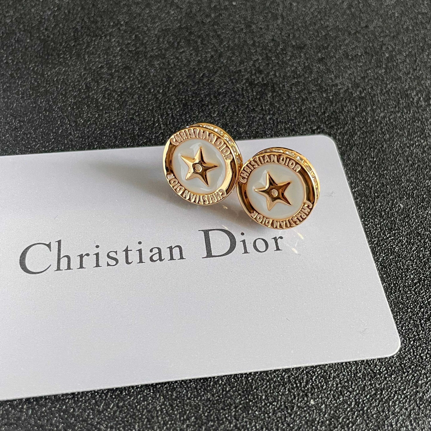 CD 26S STAR MEDALLION LOGO STUD EARRINGS IN WHITE ENAMEL & GOLD TONE METAL 631812
