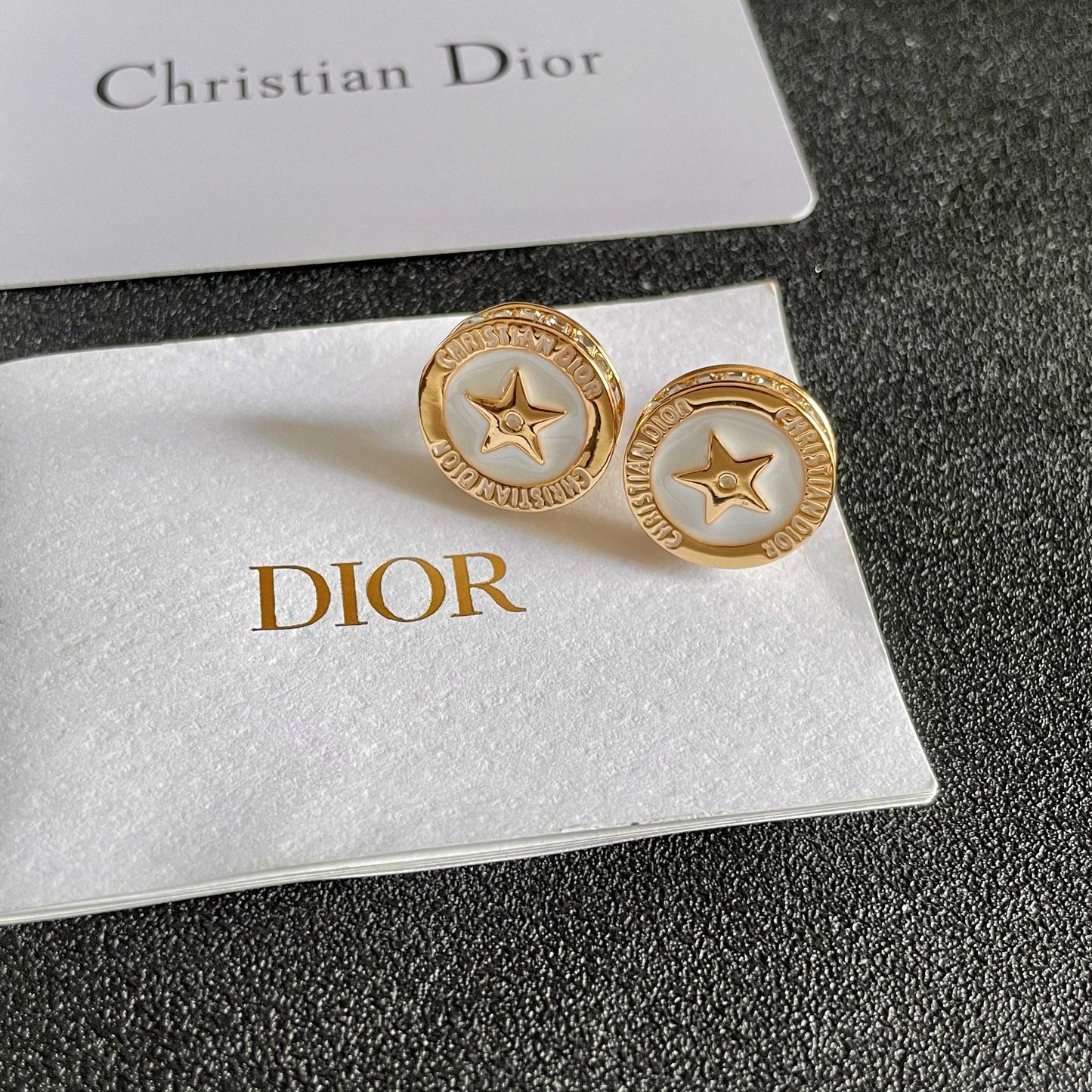 CD 26S STAR MEDALLION LOGO STUD EARRINGS IN WHITE ENAMEL & GOLD TONE METAL 631812