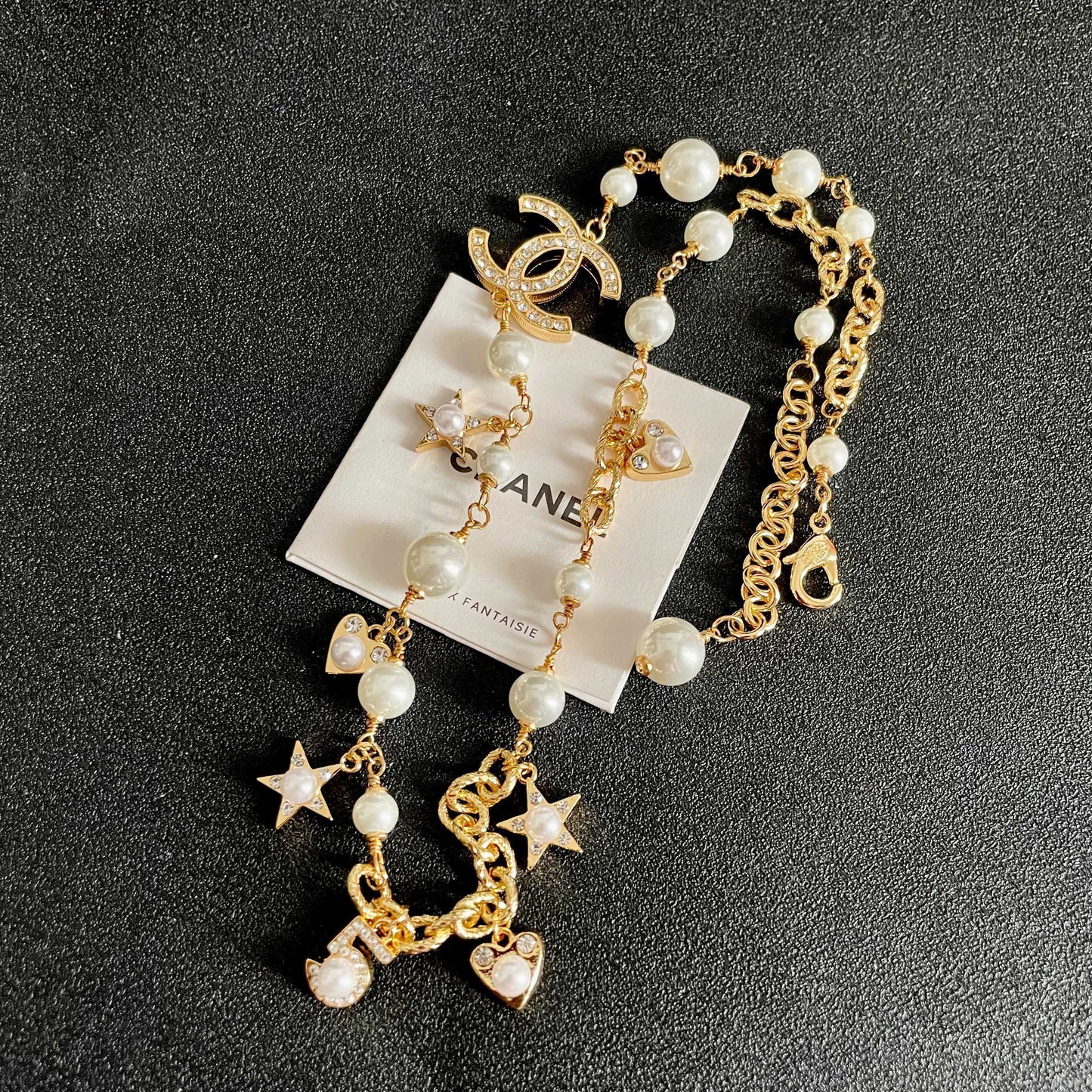 CHANEL 26S DOUBLE C LOGO PEARL CHARM NECKLACE WITH STAR AND HEART DETAILS IN GOLD METAL 631895