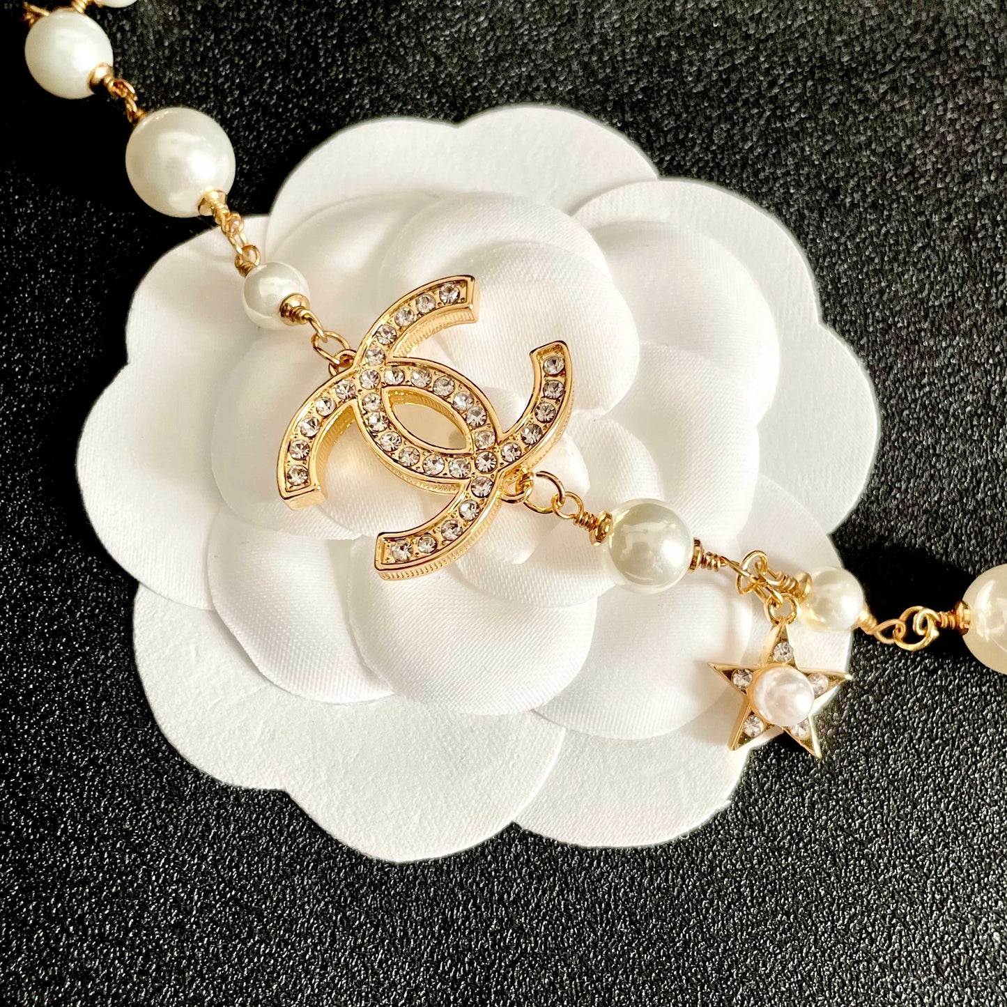 CHANEL 26S DOUBLE C LOGO PEARL CHARM NECKLACE WITH STAR AND HEART DETAILS IN GOLD METAL 631895
