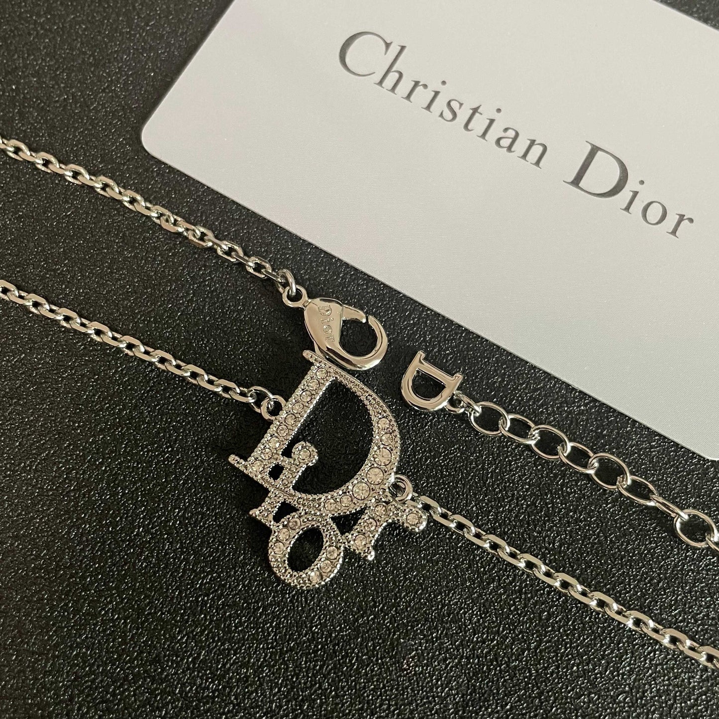 CD 26S CRYSTAL DIOR LOGO PENDANT NECKLACE IN SILVER METAL 631900