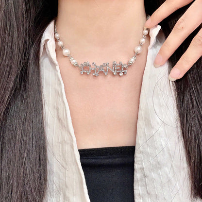 CHANEL 26S CHANEL LETTER CRYSTAL NECKLACE WITH PEARL DETAILS IN SILVER METAL 631901