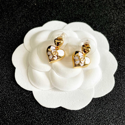 CHANEL 26S DOUBLE C HEART DROP EARRINGS WITH WHITE ENAMEL FLORAL DETAIL IN GOLD METAL 631910